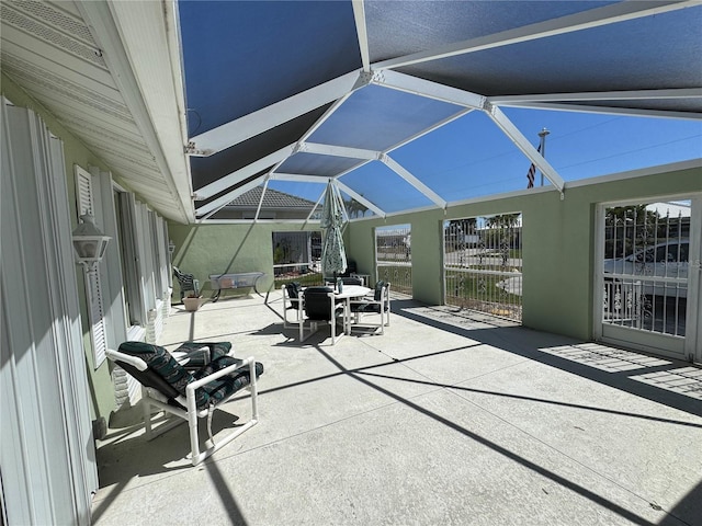 view of patio / terrace with a lanai and outdoor dining space