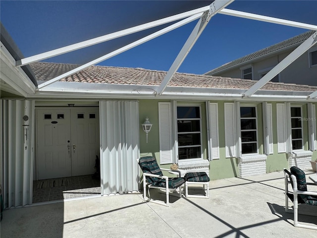 view of patio / terrace with glass enclosure