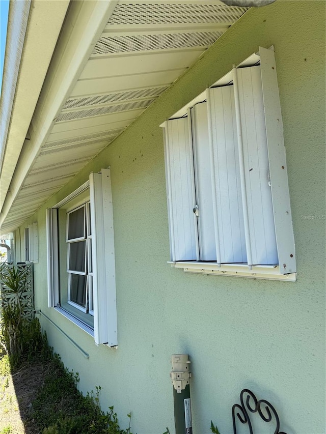 view of side of property featuring stucco siding