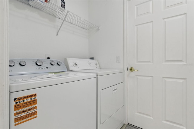 laundry area with washing machine and dryer and laundry area