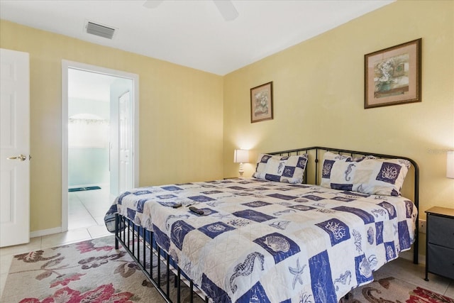 tiled bedroom with visible vents, connected bathroom, and a ceiling fan