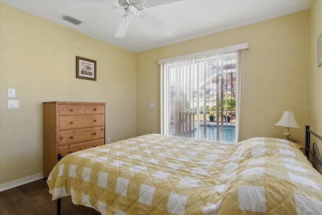 bedroom with a ceiling fan, baseboards, visible vents, dark wood-type flooring, and access to outside