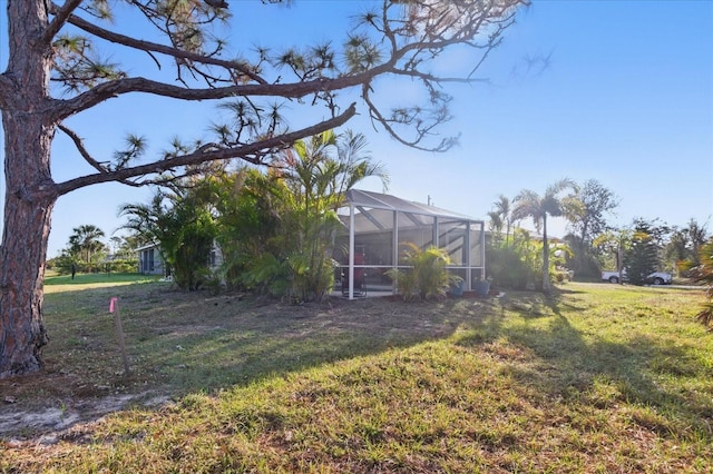 view of yard featuring a lanai