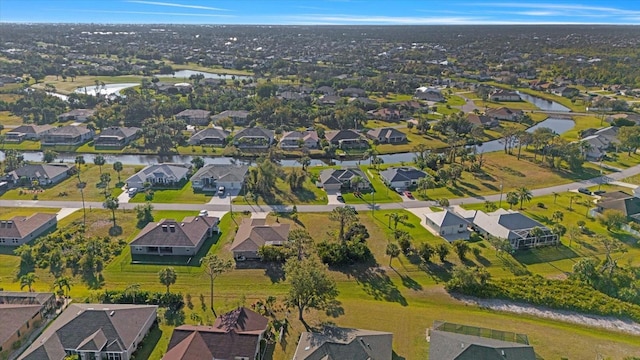 aerial view with a residential view and a water view