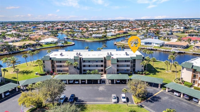 aerial view with a residential view and a water view