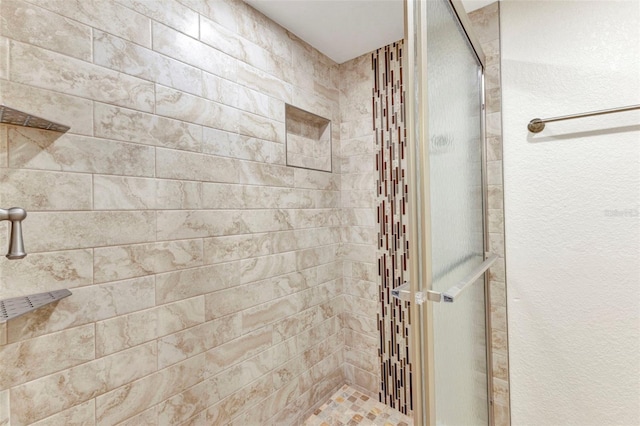 full bathroom with a shower stall