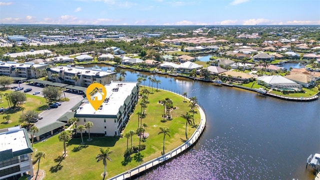 aerial view featuring a residential view and a water view