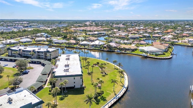 bird's eye view with a residential view and a water view