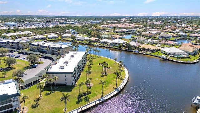 bird's eye view with a residential view and a water view