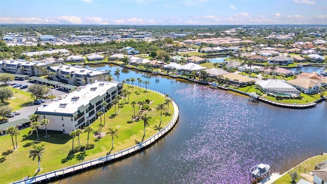 aerial view featuring a residential view and a water view