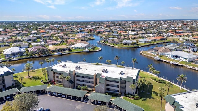 aerial view featuring a residential view and a water view