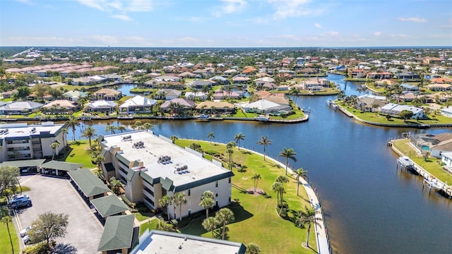 bird's eye view with a residential view and a water view