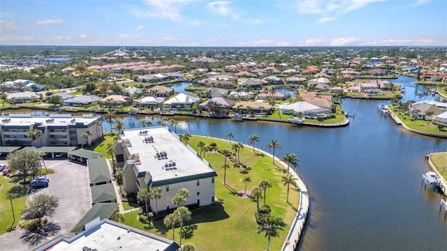 bird's eye view with a residential view and a water view