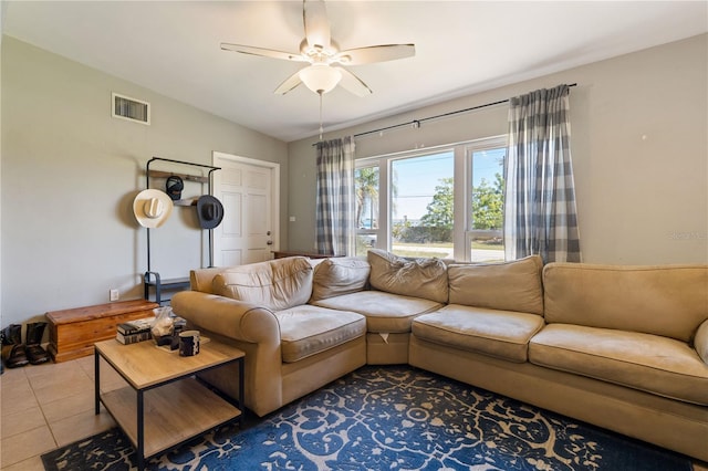 living room with visible vents, ceiling fan, and tile patterned flooring