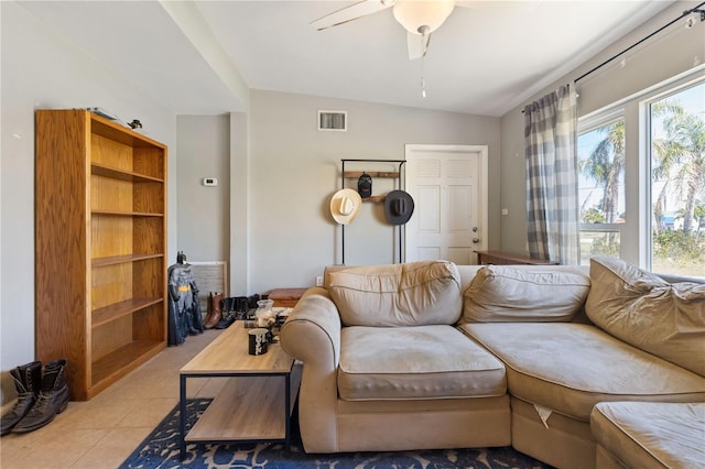 tiled living area featuring visible vents and ceiling fan