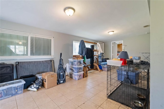 interior space featuring tile patterned floors and visible vents