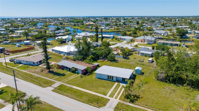 aerial view featuring a residential view and a water view