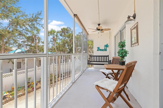 balcony featuring a ceiling fan