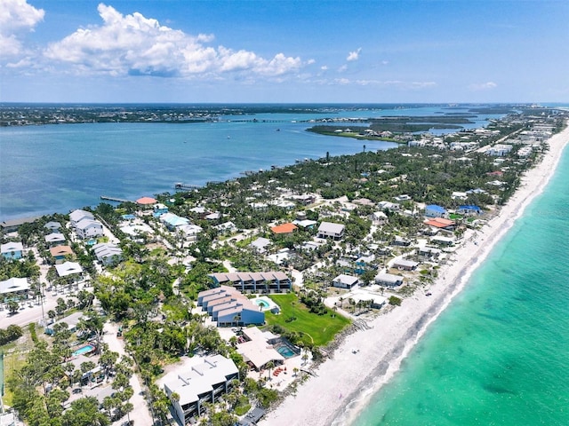 drone / aerial view with a water view and a view of the beach