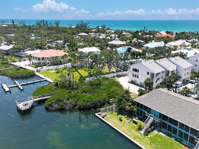 bird's eye view featuring a residential view and a water view