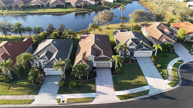 aerial view with a residential view and a water view