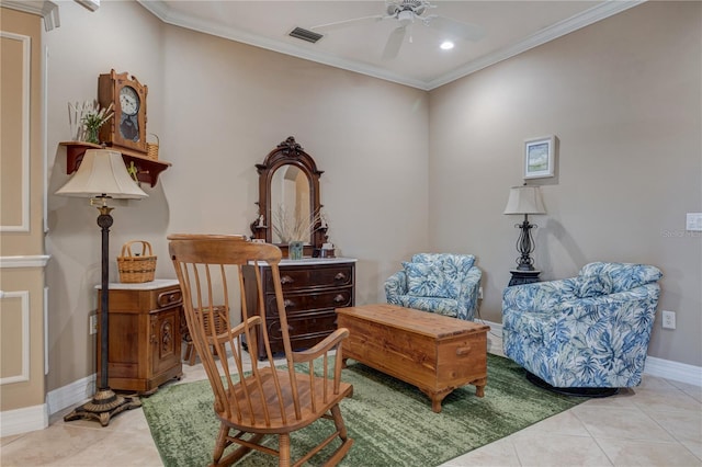 living area with light tile patterned floors, visible vents, crown molding, and a ceiling fan