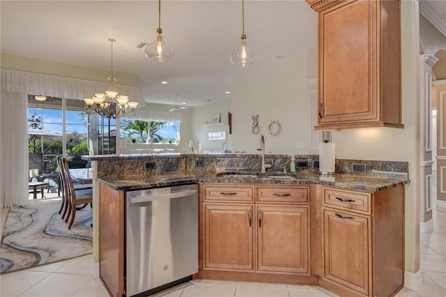 kitchen with a sink, plenty of natural light, stainless steel dishwasher, and brown cabinetry