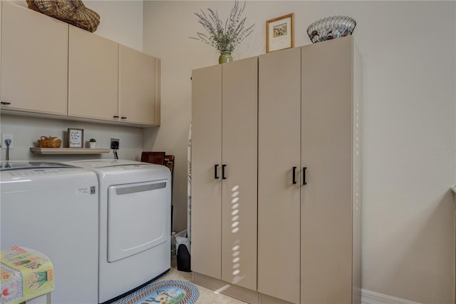 laundry area featuring cabinet space and washing machine and clothes dryer