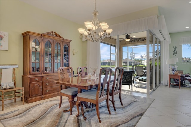 dining space featuring an inviting chandelier and light tile patterned flooring