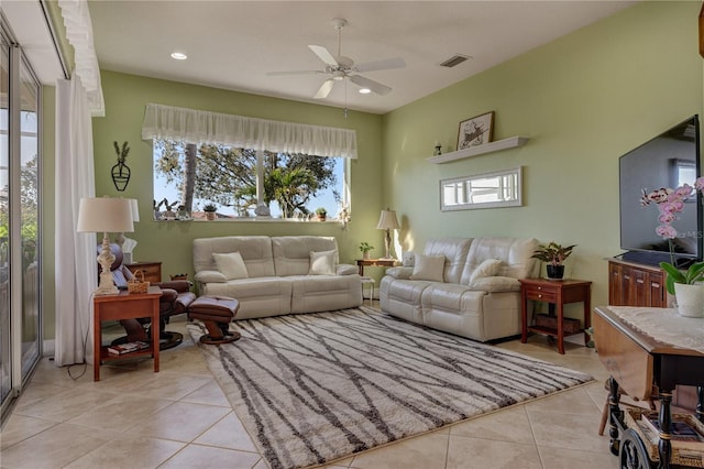 living area featuring light tile patterned flooring, recessed lighting, visible vents, and ceiling fan