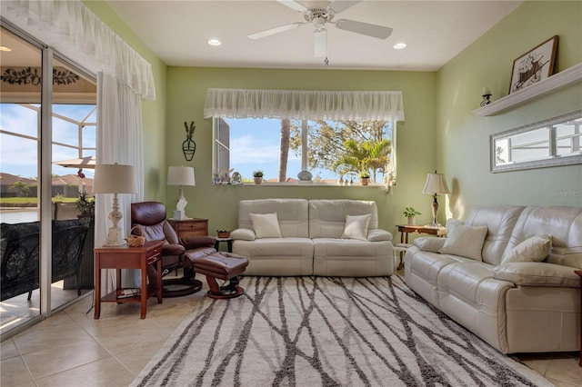 living area featuring recessed lighting, a ceiling fan, and tile patterned flooring