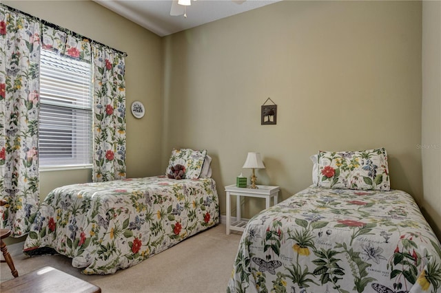 carpeted bedroom featuring a ceiling fan