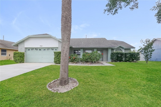 single story home with brick siding, a front yard, an attached garage, and driveway