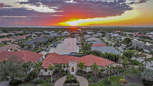 1111 San Mateo Dr, Punta Gorda, FL 33950 - aerial view at dusk featuring a residential view and a water view