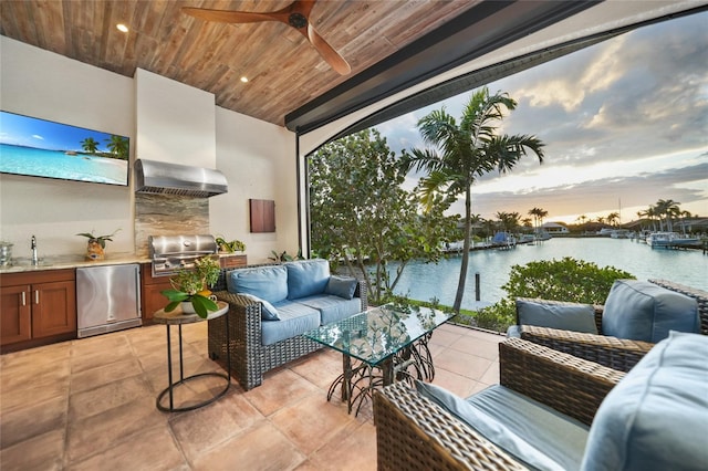 1111 San Mateo Dr, Punta Gorda, FL 33950 - view of patio featuring exterior kitchen, a grill, ceiling fan, a water view, and an outdoor hangout area