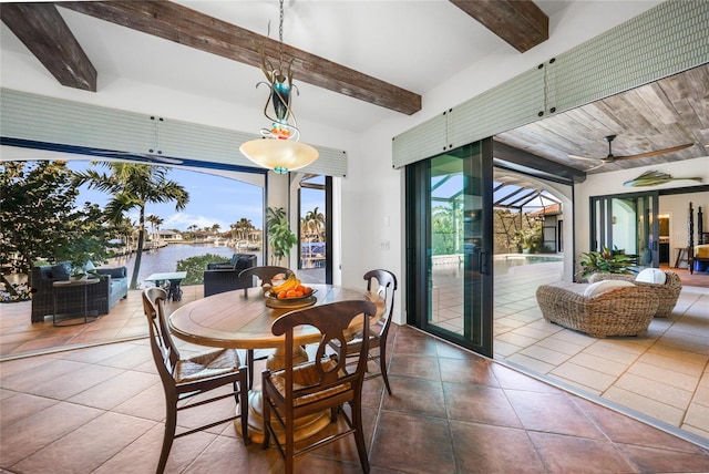 1111 San Mateo Dr, Punta Gorda, FL 33950 - sunroom featuring plenty of natural light, beamed ceiling, ceiling fan, and a water view