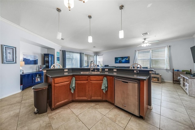 kitchen with dark countertops, open floor plan, dishwasher, and a sink