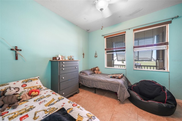 bedroom with light tile patterned flooring and a ceiling fan