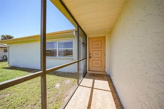 property entrance featuring stucco siding