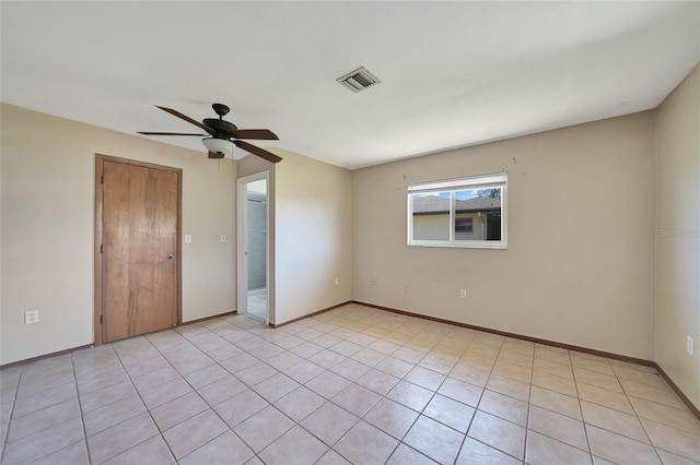 unfurnished bedroom featuring baseboards, visible vents, and ceiling fan