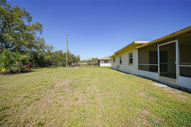 view of yard featuring a sunroom