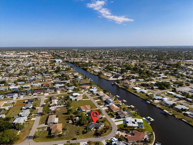 bird's eye view featuring a residential view and a water view