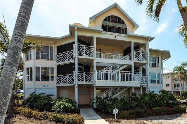 exterior space with stucco siding and stairs