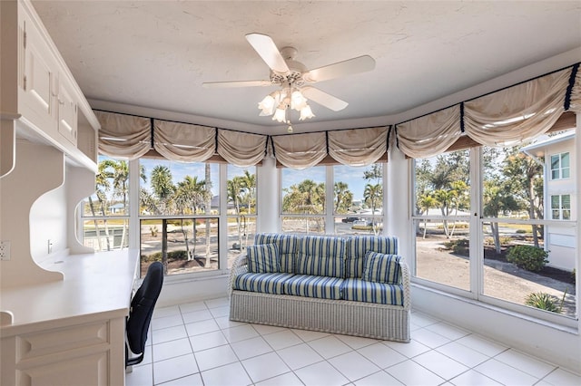 sunroom with a healthy amount of sunlight and a ceiling fan