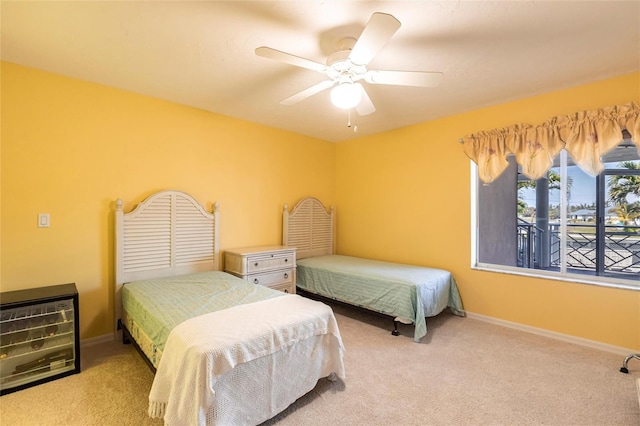 bedroom with baseboards, carpet floors, and ceiling fan