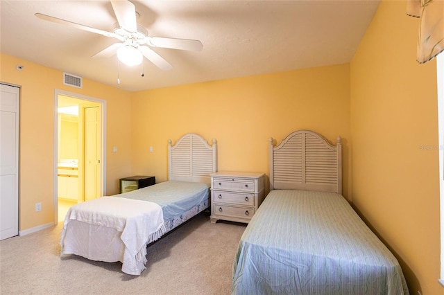 carpeted bedroom featuring visible vents, a ceiling fan, a wall mounted AC, connected bathroom, and baseboards