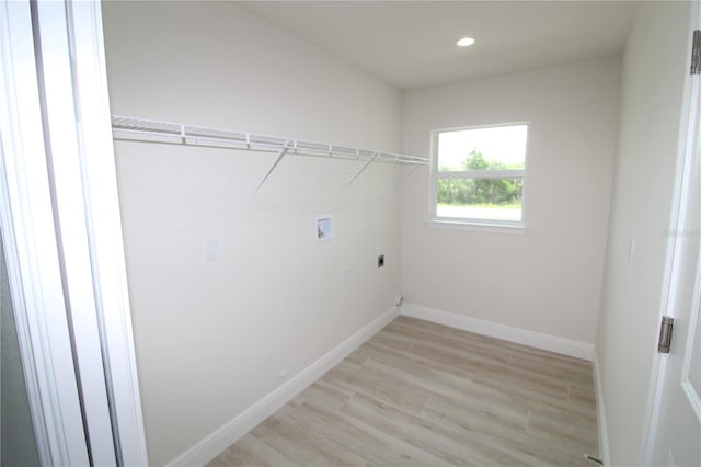 9529 Calumet Blvd, Port Charlotte, FL 33981 - laundry area with hookup for a washing machine, hookup for an electric dryer, baseboards, light wood-type flooring, and recessed lighting