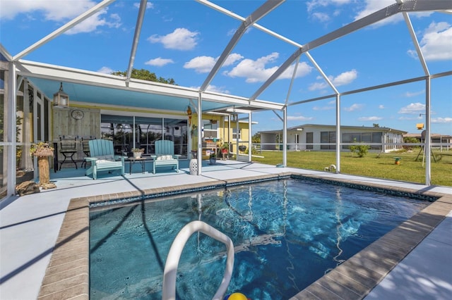 outdoor pool featuring a patio area, a lanai, and a yard