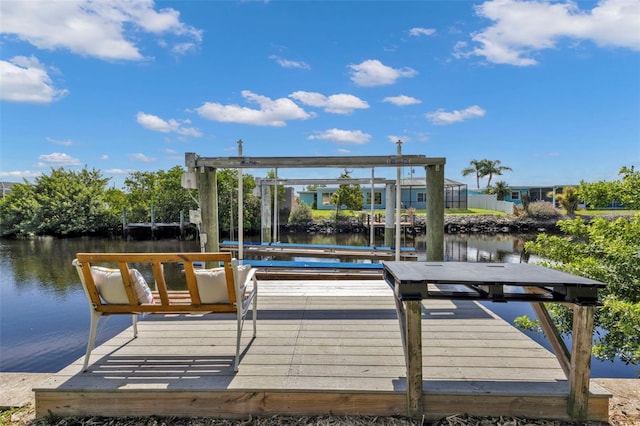 view of dock with a water view and boat lift