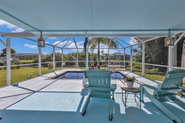 pool featuring a patio, a lawn, and a lanai